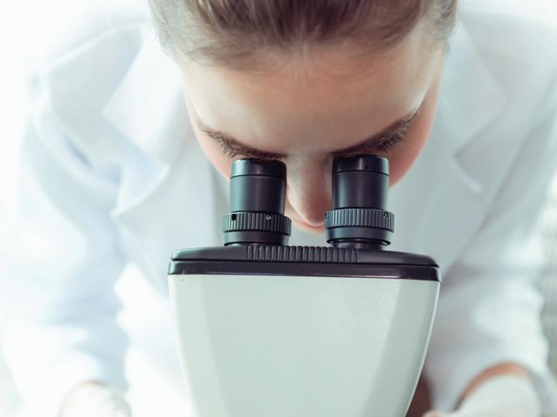 Woman using a microscope