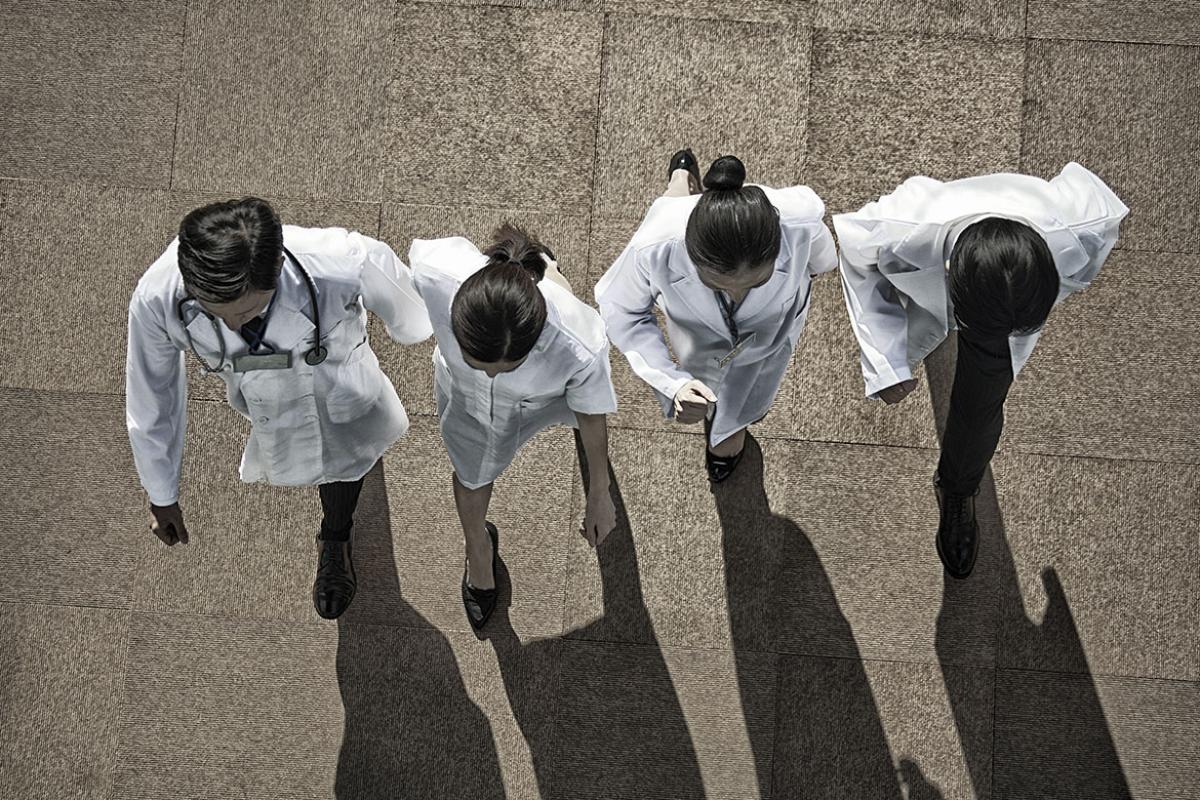 Health care workers walking in a line